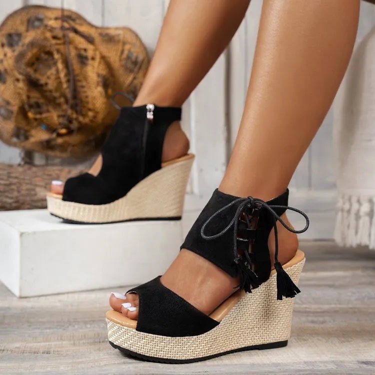 Bohemian tan peep toe lace-up wedge sandals with tassel details, stylish trendy shoe for casual or summer wear.