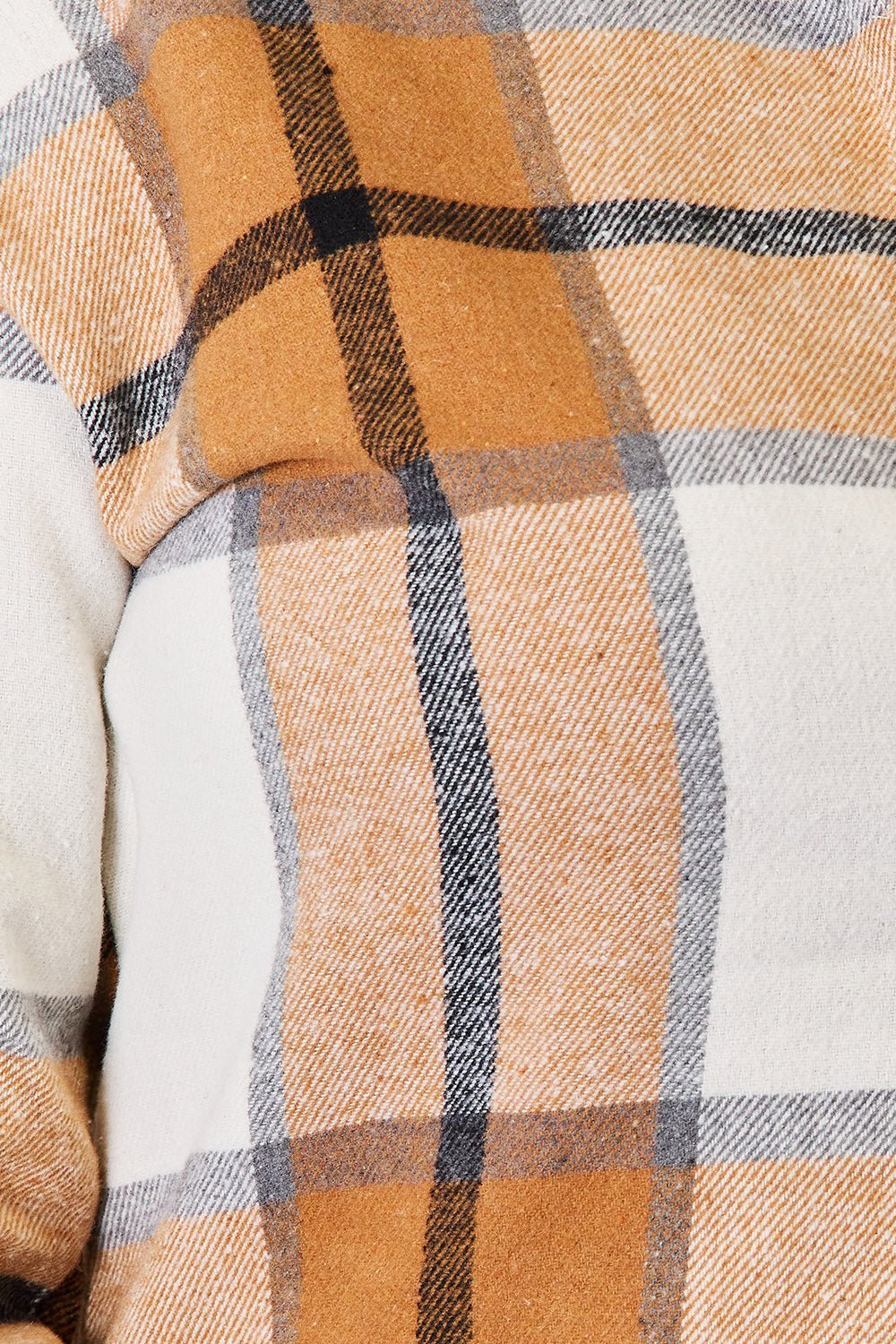 Women’s casual plaid long sleeve shirt with dropped shoulders from Plush Fashion Hub, featuring a relaxed fit and classic print.