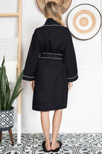 Knee-length waffle robe for women by Lotus Linen, featuring a cozy, textured fabric and a relaxed fit, ideal for lounging.