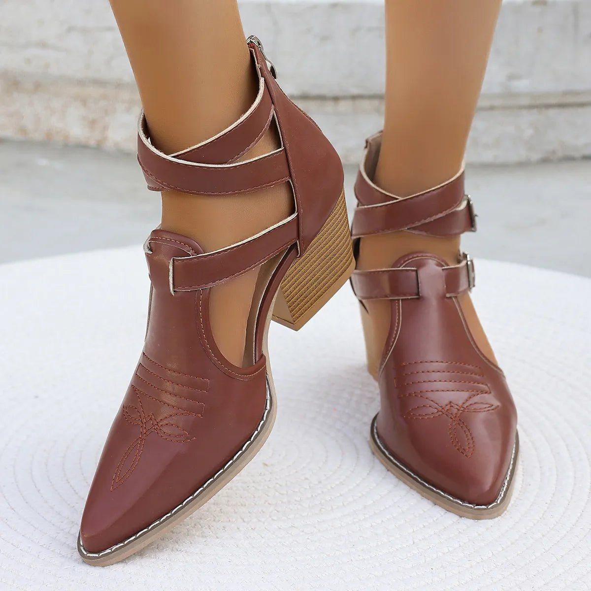 Women's pointed toe block heel sandals in neutral color, featuring comfortable mid-heel design and stylish dress shoe style.