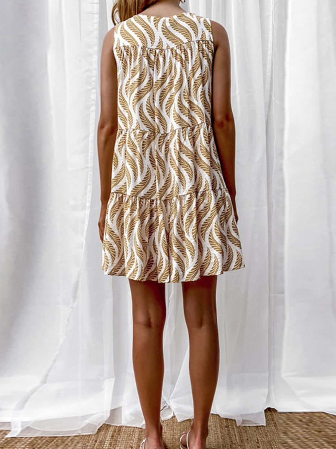Printed V-neck sleeveless A-line summer mini dress for women by Plush Fashion Hub, featuring colorful floral pattern and lightweight fabric.