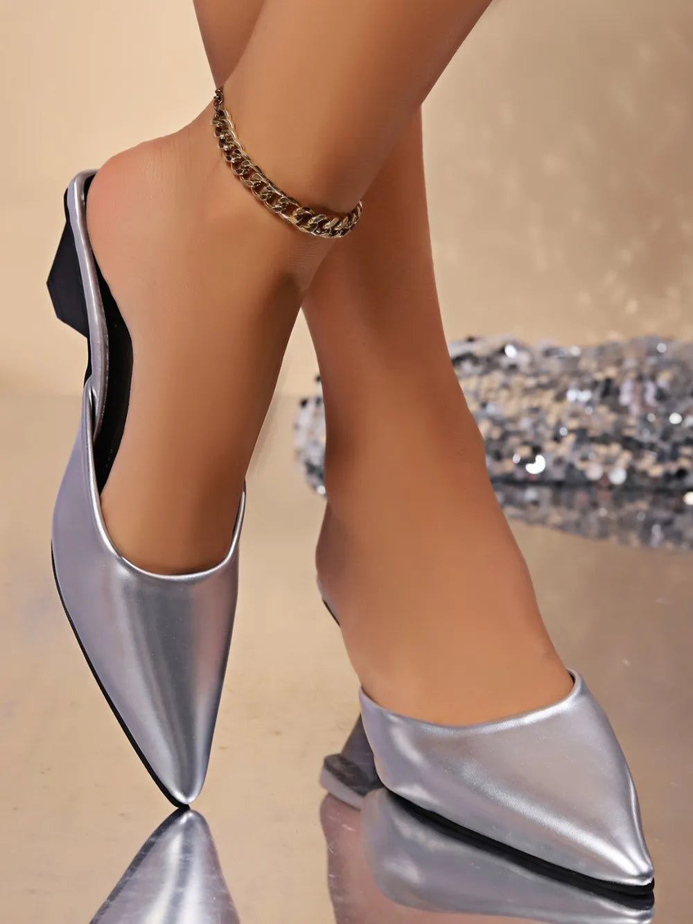Women's pointed toe low heel faux leather dress sandals by Plush Fashion Hub, showcasing sleek design and stylish silhouette.