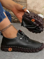 Women's comfortable PU leather slip-on flats with round toes, stylish and easy to wear, by Trendsi.