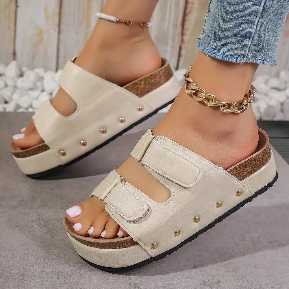 Women's studded PU leather platform sandals by Plush Fashion Hub, featuring a chunky heel and multiple metal stud accents.