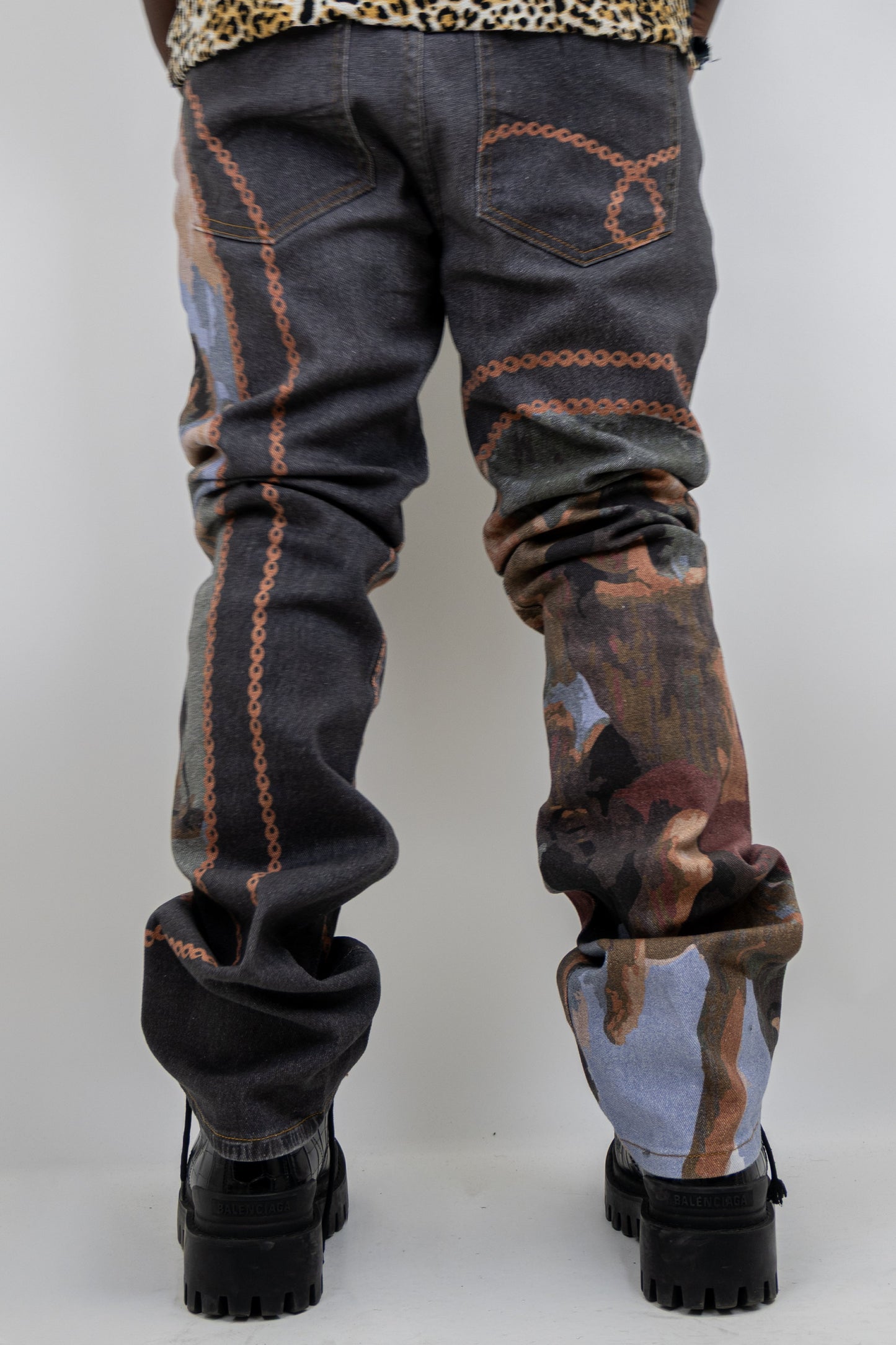 Purple graphic printed stacked jeans by Plush Fashion Hub, showcasing stylish denim with bold design details.