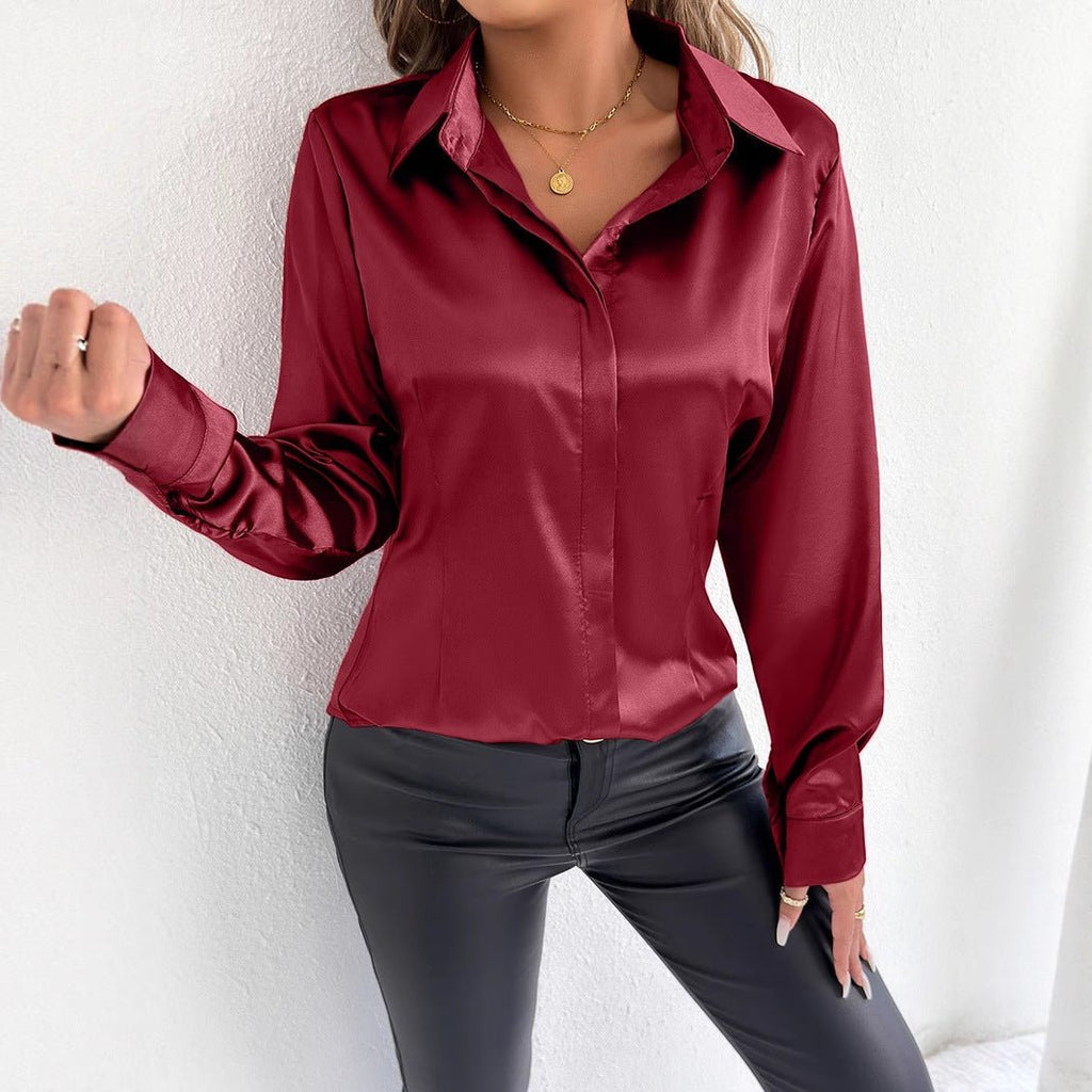 Real shot of a women's satin summer shirt from Bella Mia, featuring a smooth artificial silk fabric and stylish design.