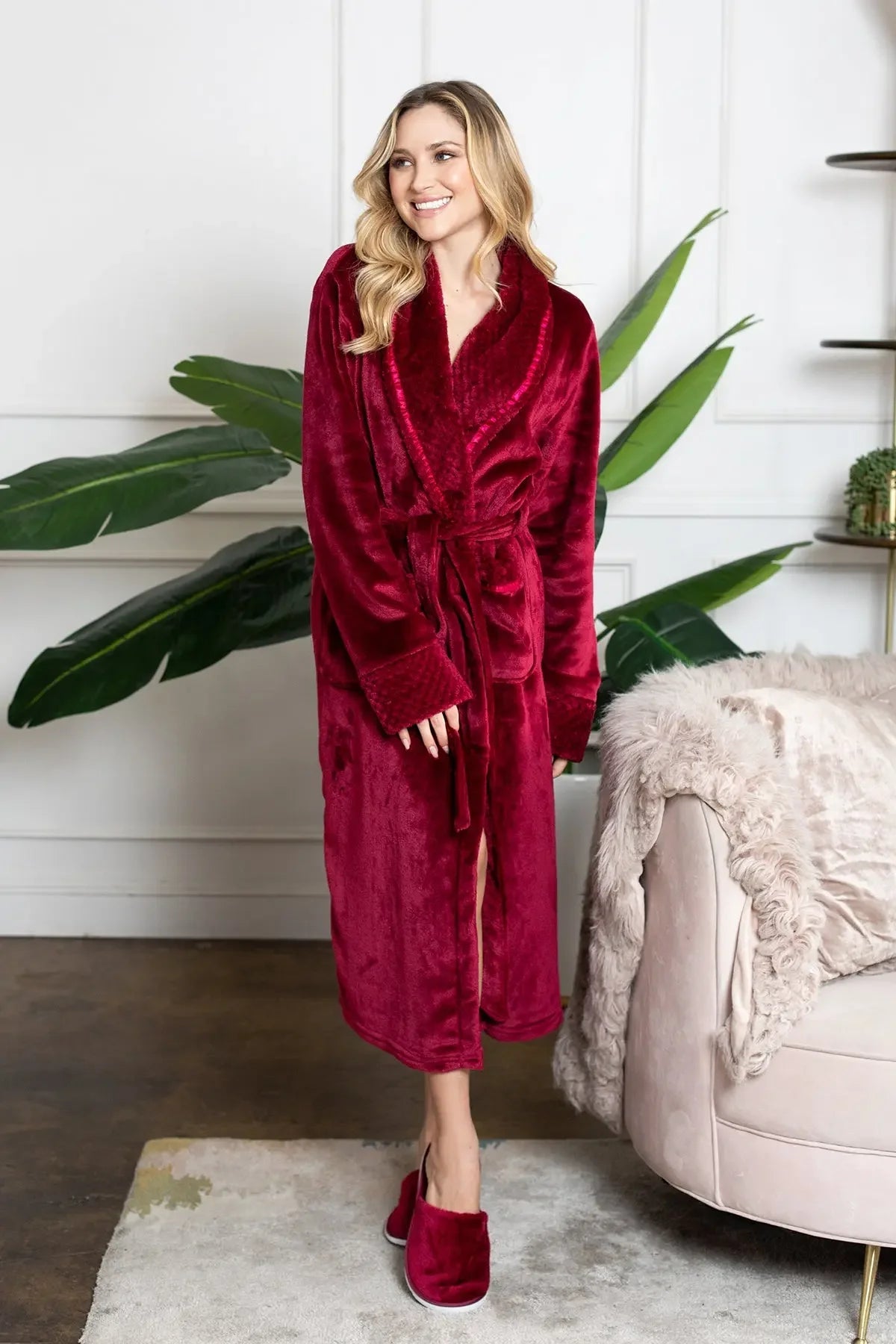 Red Lotus Linen women's ultra-soft plush bathrobe hanging open, showing cozy collar and long sleeves.