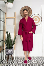 Red Lotus Linen men's waffle spa bathrobe hanging, lightweight and absorbent, ideal for comfortable post-bath relaxation.