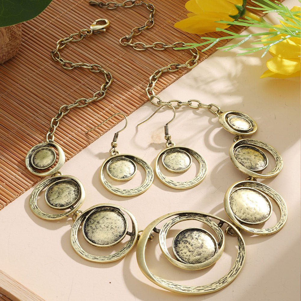 Retro oil-dropped hollow round earrings and matching women's necklace in jewelry set, featuring vintage-inspired design.