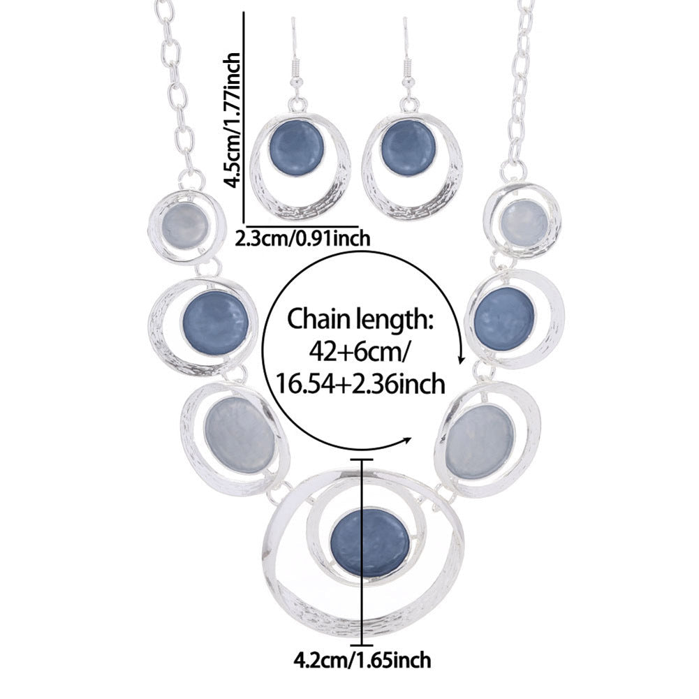 Retro oil-dropped hollow round earrings and women's necklace set, stylish jewelry with a vintage-inspired design.
