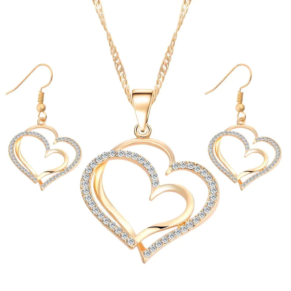 Double heart earrings and necklace wedding set by Trendy Attic Store01, featuring matching silver jewelry with heart-shaped charms.