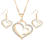 Double heart earrings and necklace wedding set by Trendy Attic Store01, featuring matching silver jewelry with heart-shaped charms.
