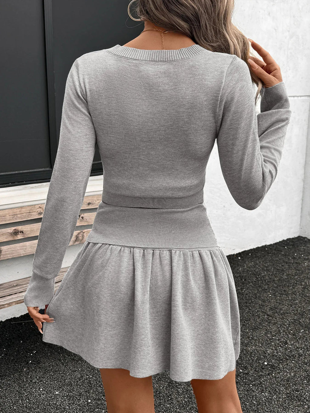 Women's ribbed long sleeve top and pleated knit skirt two-piece set, stylish women's apparel by Trendsi.