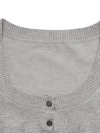 Women's ribbed long sleeve top and pleated knit skirt two-piece set, stylish women’s apparel from Trendsi.