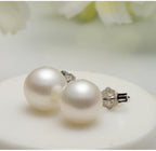Sterling silver freshwater pearl ear studs featuring needle design, elegant and natural for everyday wear.