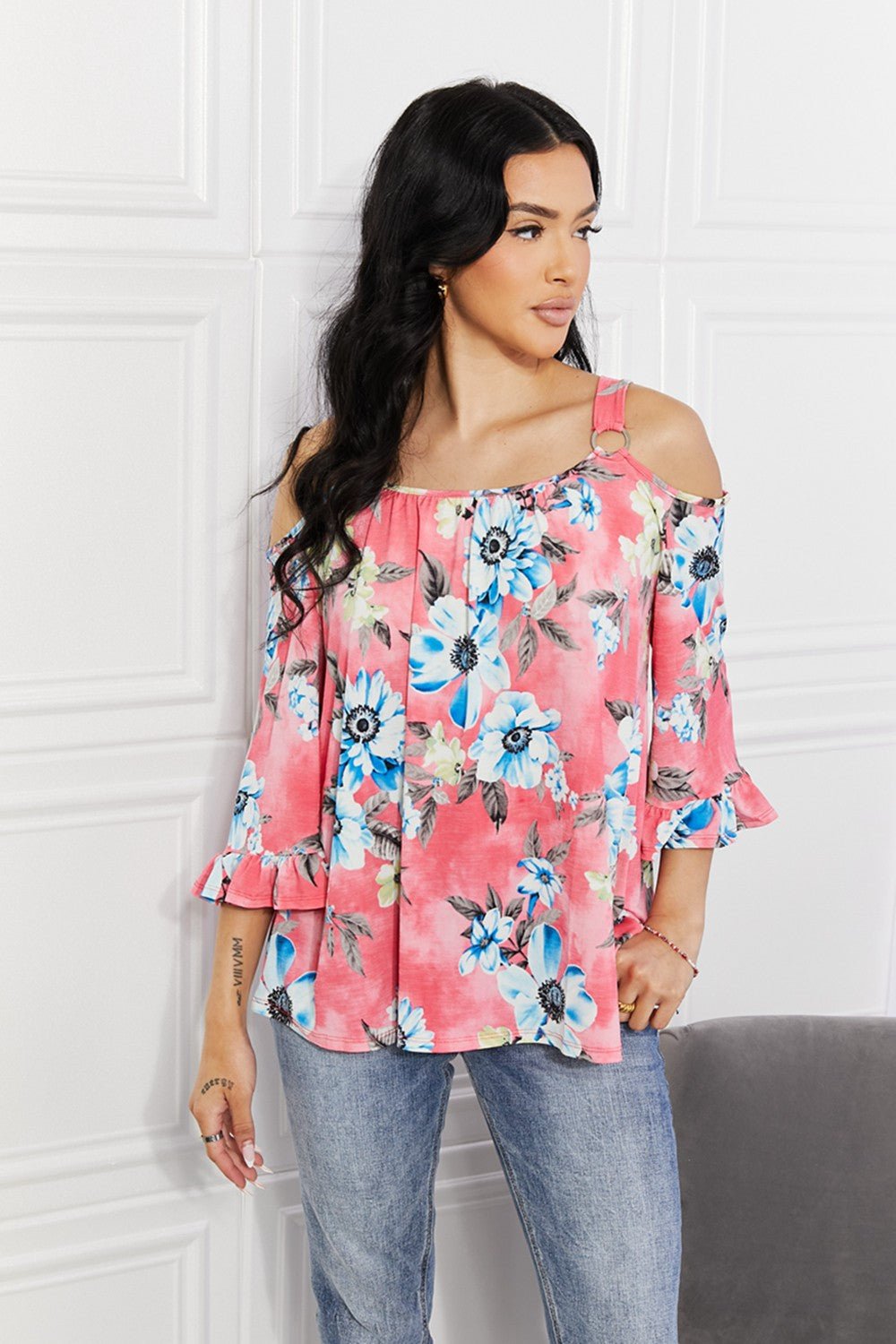 Floral cold-shoulder three-quarter sleeve top with metal ring details, women's apparel by Plush Fashion Hub.