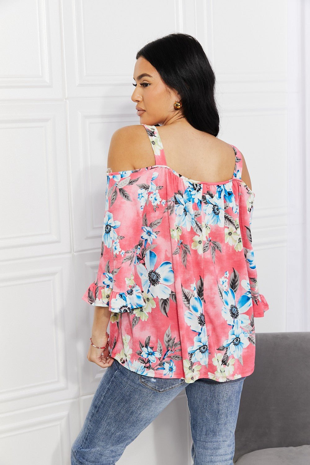Floral cold-shoulder three-quarter sleeve top with metal ring details, women's apparel by Plush Fashion Hub, stylish and fresh design.