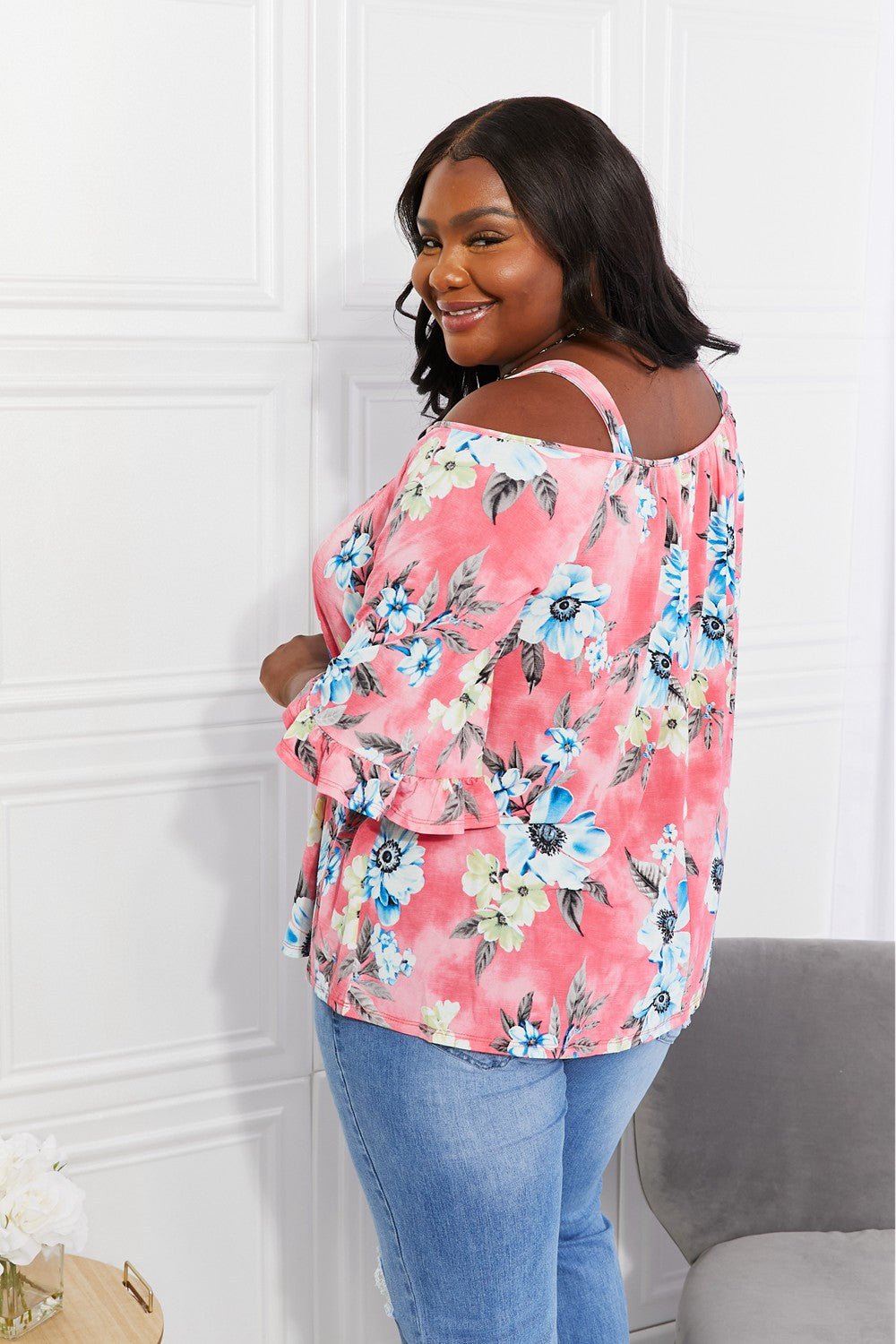 Floral cold-shoulder three-quarter sleeve top with metal ring details, women's apparel by Plush Fashion Hub.