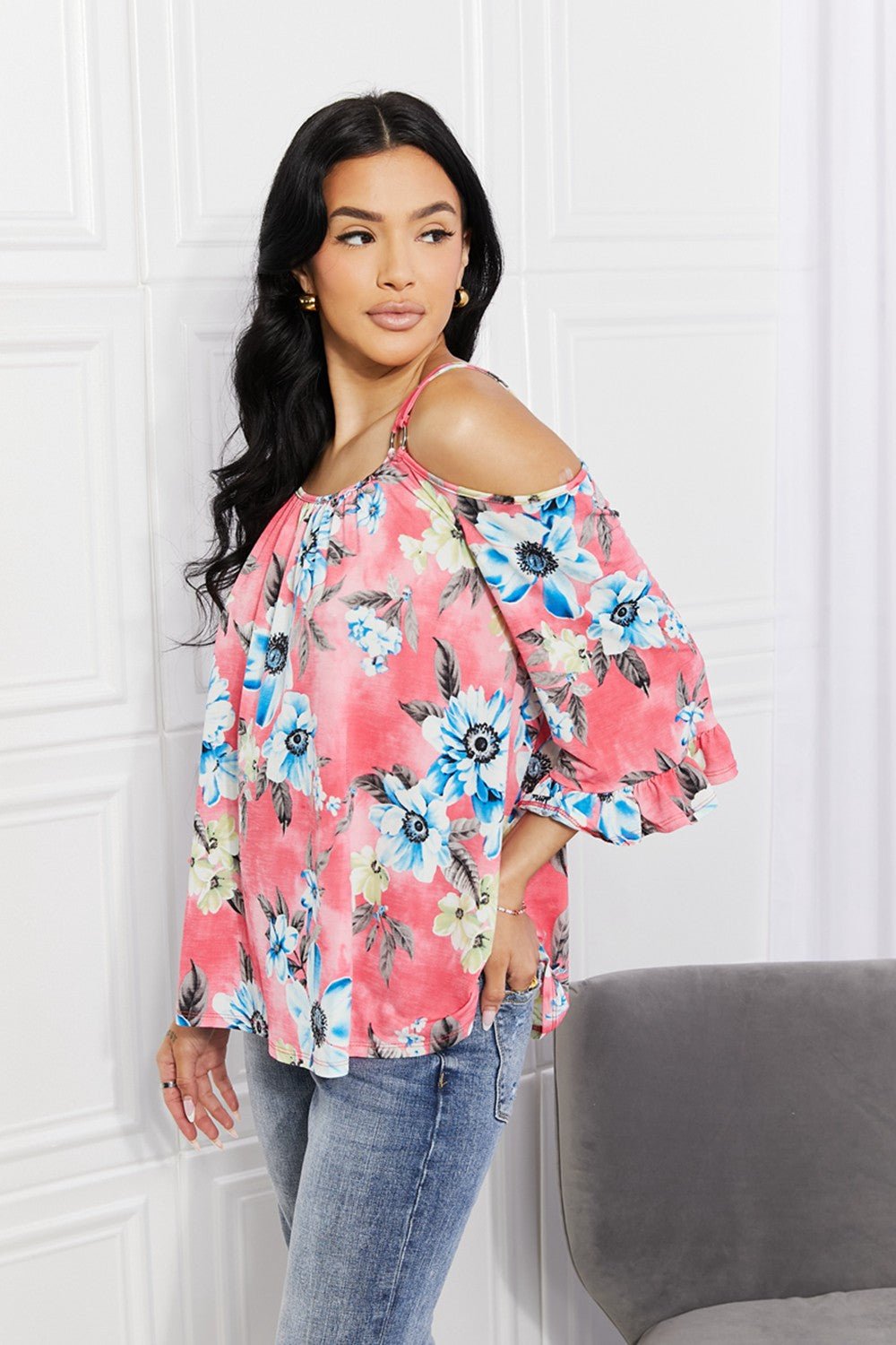 Floral cold-shoulder women's top with three-quarter sleeves and metal ring details, stylish fashion from Plush Fashion Hub.
