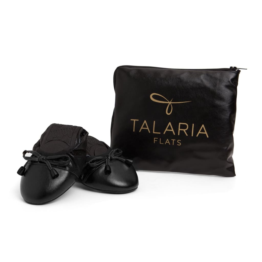 Black Talaria Flats shoes with sleek, minimalist design and comfortable flat sole, perfect for everyday wear.