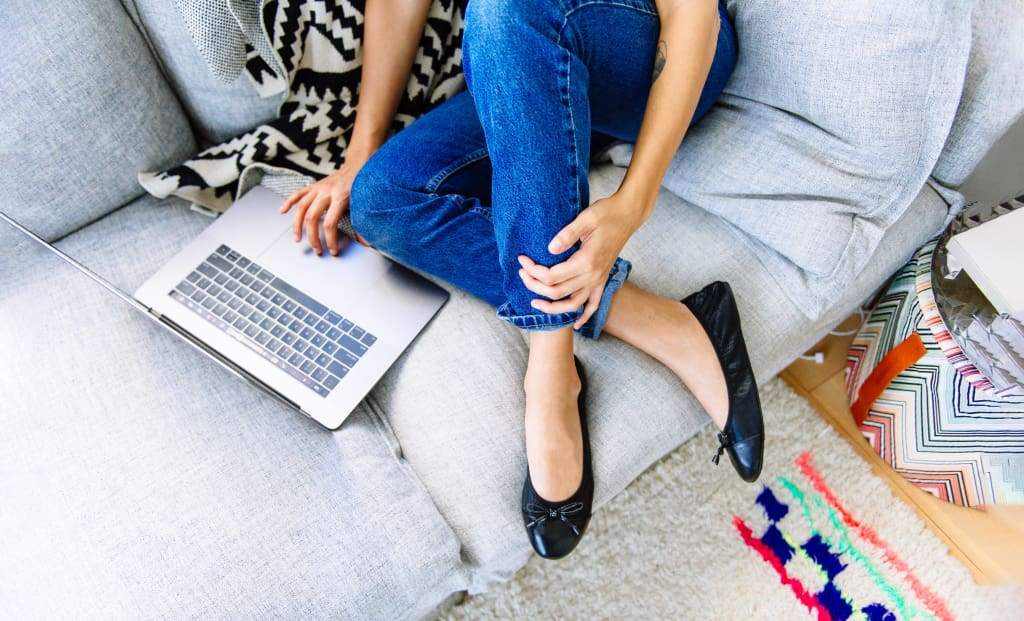Black Talaria Flats shoes with sleek, minimal design and comfortable flat soles.