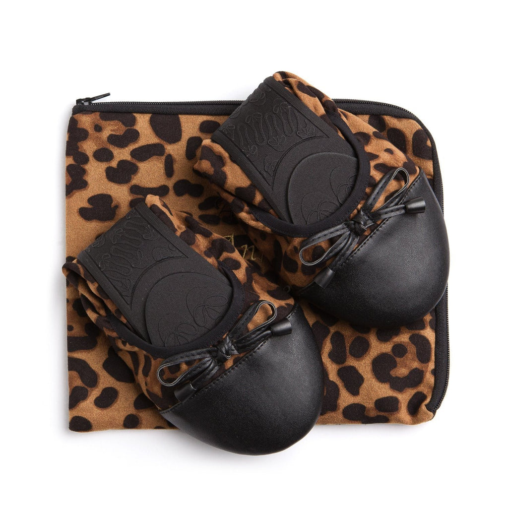 Premium leopard flats by New Arrivals featuring stylish animal print and comfortable slip-on footwear for women.