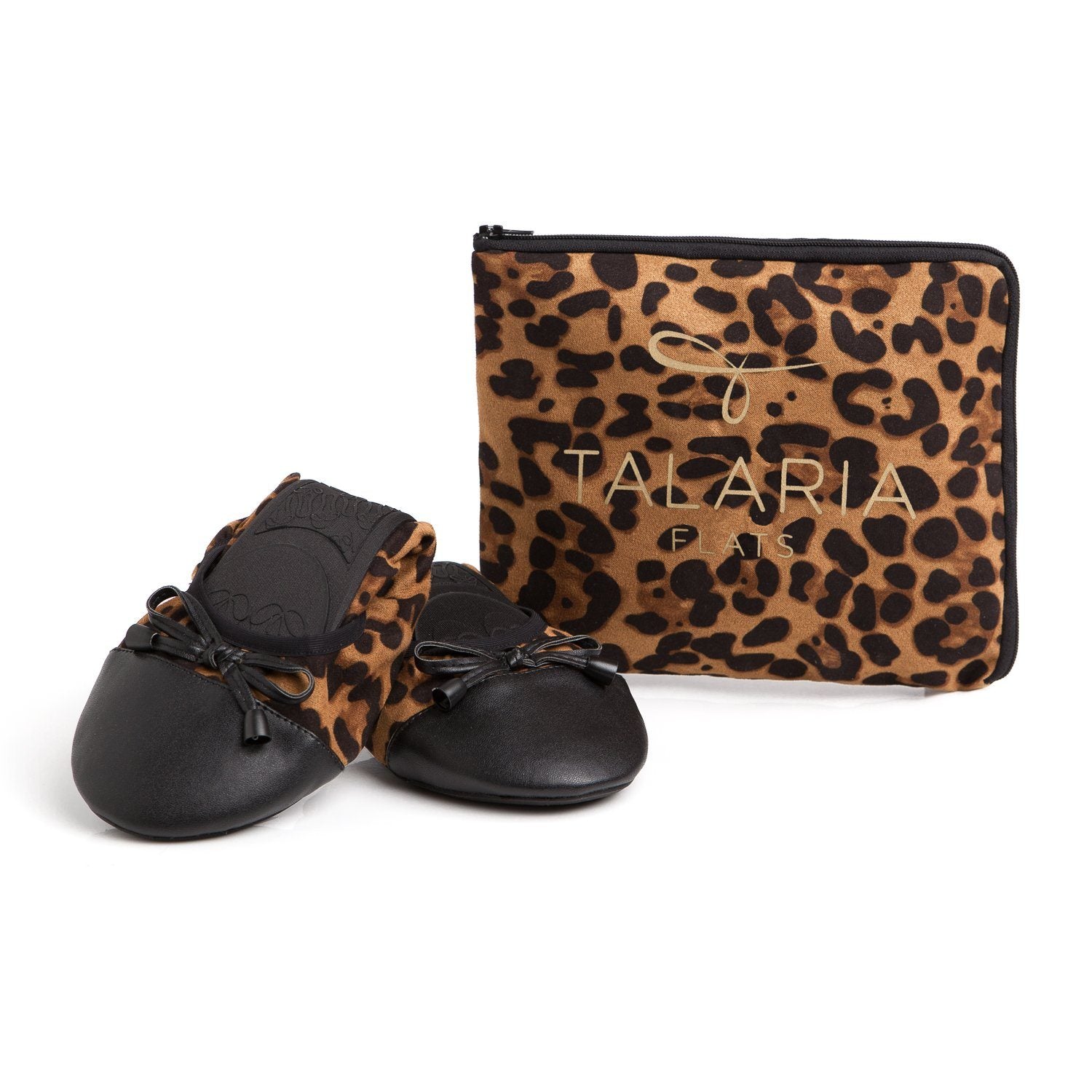Leopard print flats by New Arrivals featuring stylish, comfortable footwear with a sleek design and pointed toe.
