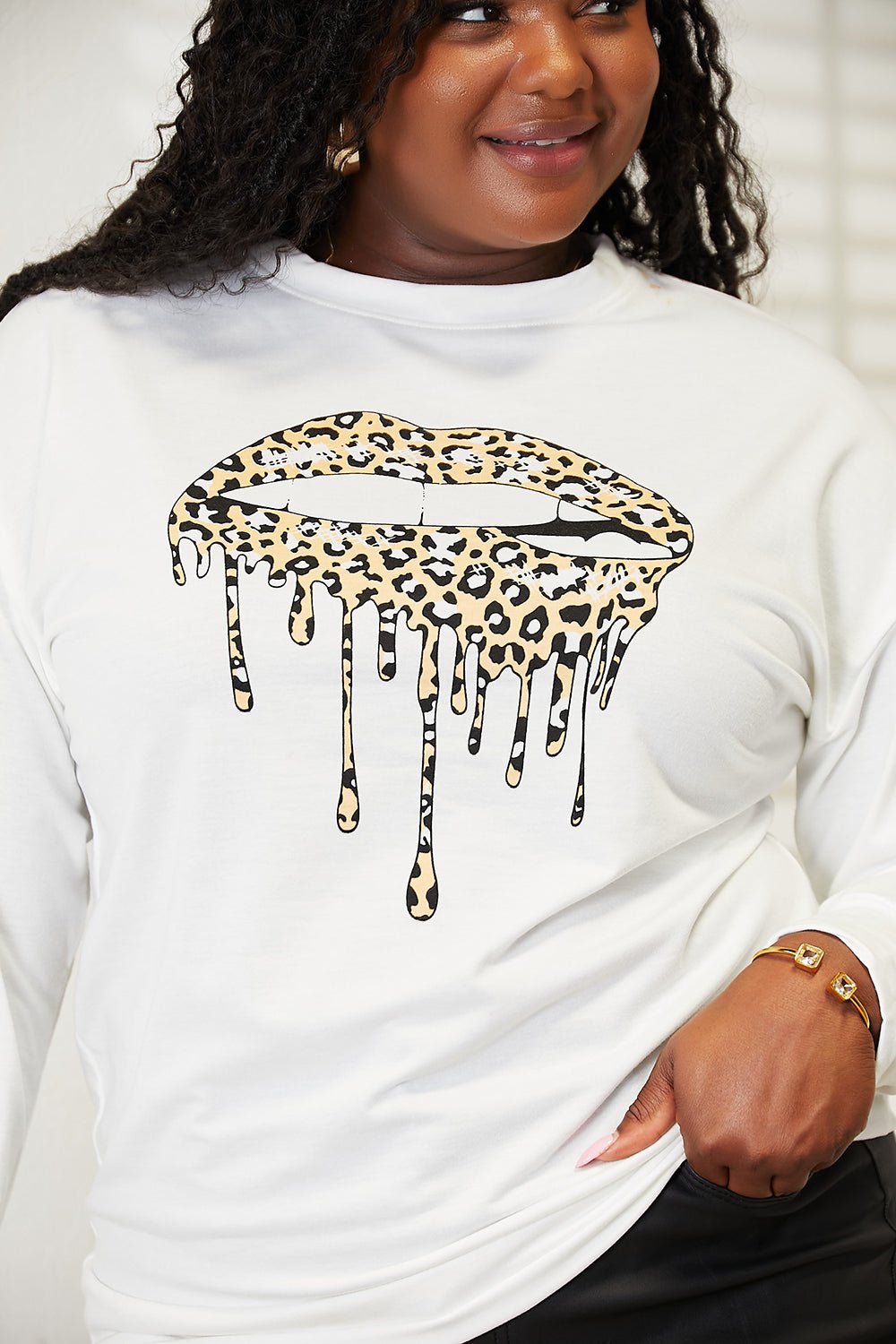 Women's Plush Fashion Hub Simply Love graphic print dropped shoulder sweatshirt with round neckline and casual fit.
