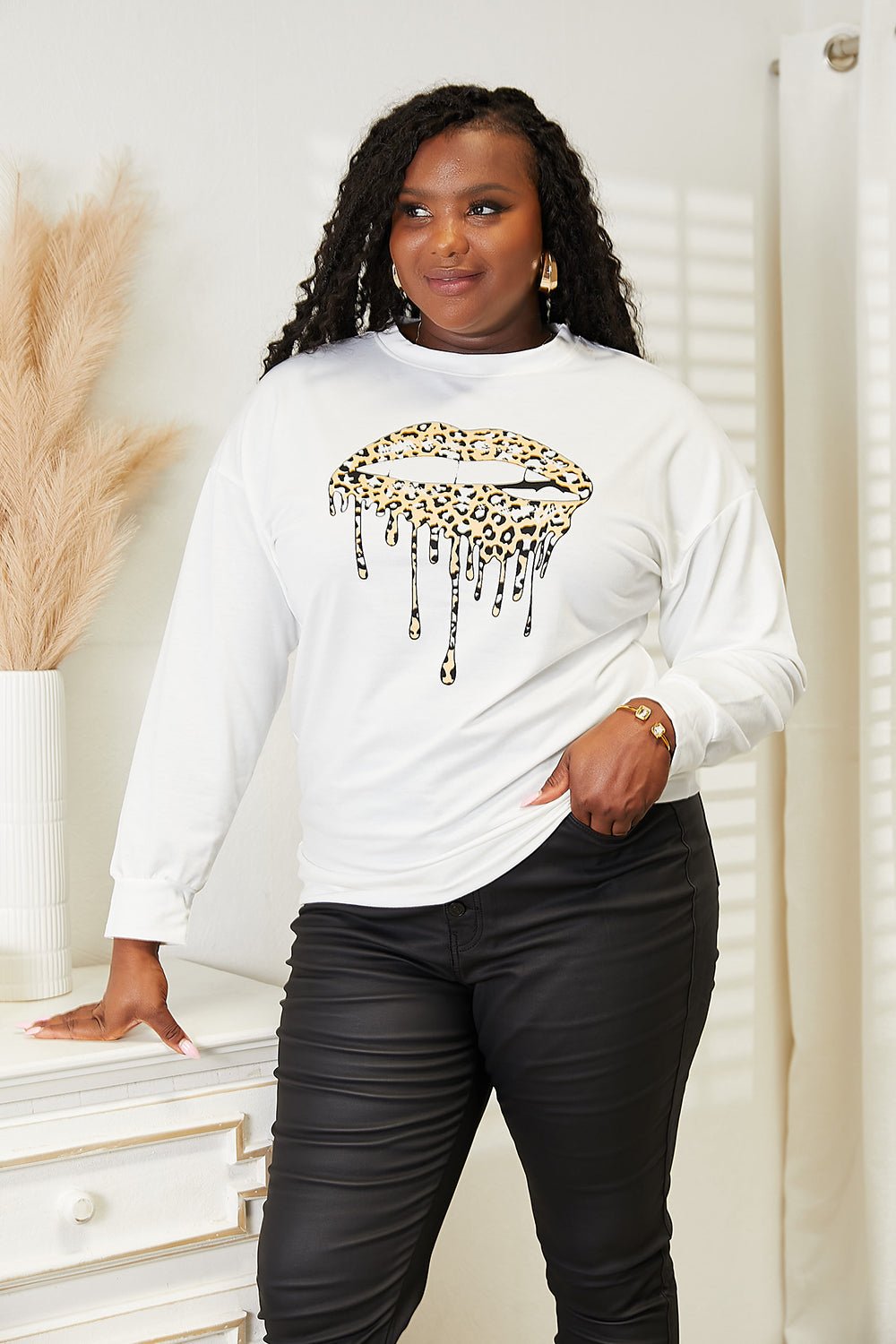 Women's Simply Love graphic print dropped shoulder sweatshirt by Plush Fashion Hub, featuring a round neck and casual style.
