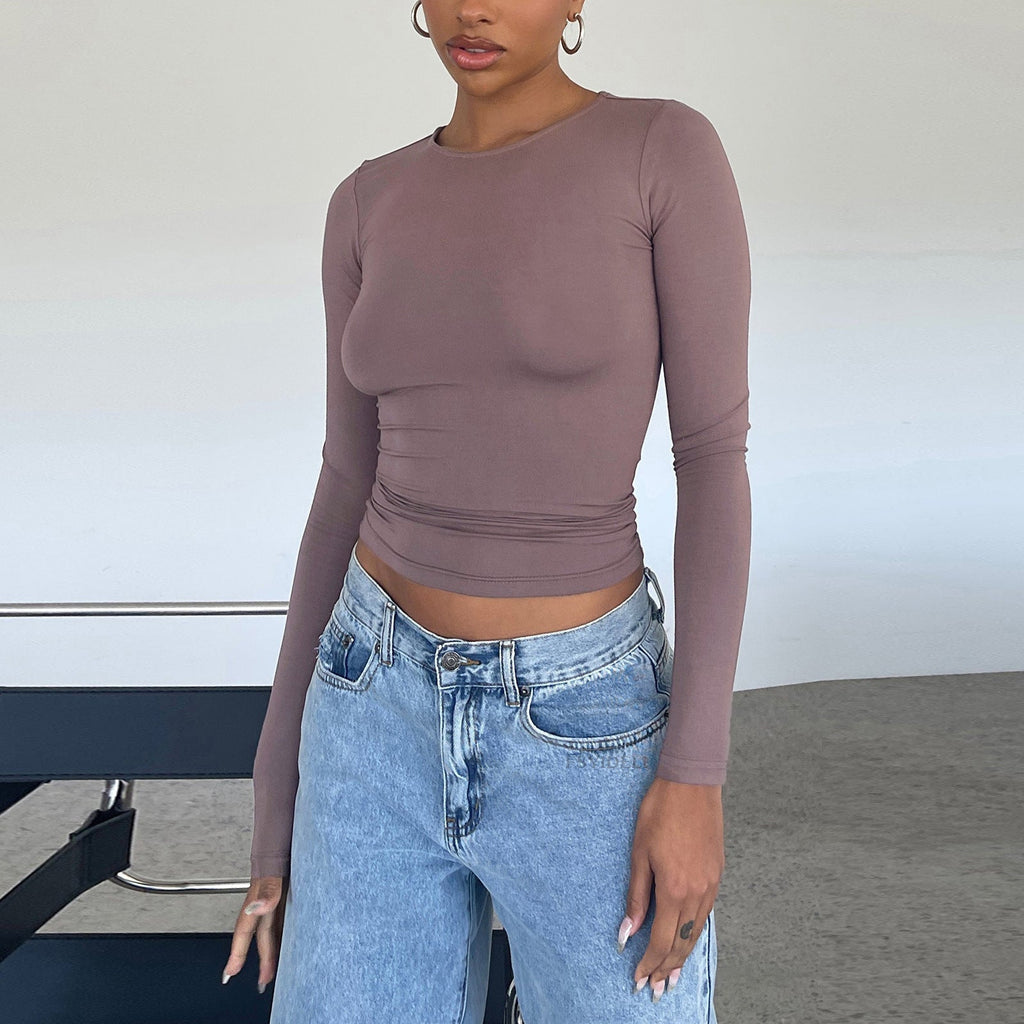 Women’s slim fit long sleeve casual crop top by FitiqueFit, featuring a fitted silhouette and versatile style for everyday wear.
