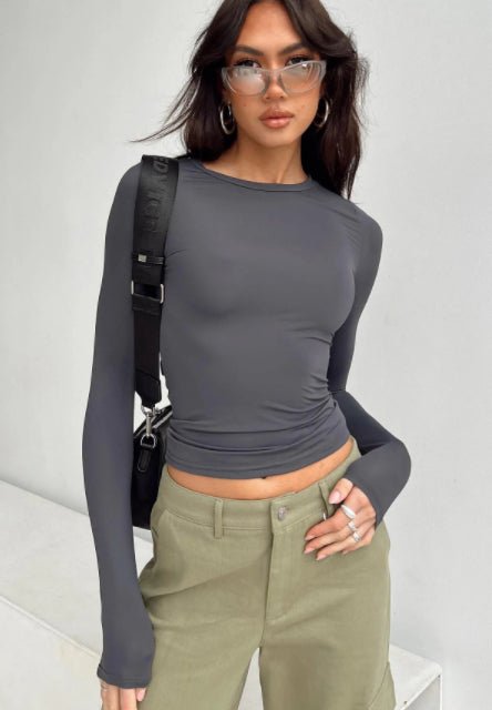 Slim fit women's long sleeve casual crop top by FitiqueFit, featuring a modern, stylish design perfect for everyday wear.