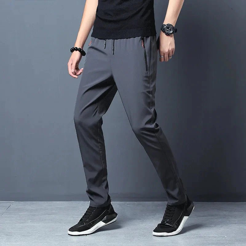 FitiqueFit slim fit stretch jogger pants with elastic waist, casualwear style, shown in a natural pose on a neutral background.