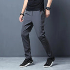 FitiqueFit slim fit stretch jogger pants with elastic waist, casualwear style, shown in a natural pose on a neutral background.