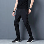 FitiqueFit slim fit stretch jogger pants with elastic waistband, casualwear style, shown in black with tapered fit and comfortable fabric.