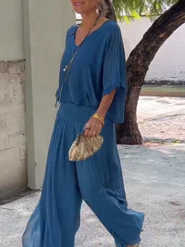 Solid-color chiffon two-piece casualwear set by FitiqueFit in various colors, featuring a loose top and matching skirt for comfortable style.