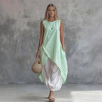 Light blue sleeveless loose-fit casual dress with patch pockets by FitiqueFit, perfect for relaxed everyday wear.