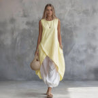 Light blue sleeveless loose-fit casual dress with patch pockets by FitiqueFit, perfect for warm weather and relaxed styling.