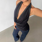 Solid-color women's top with stud accents, stylish and sexy, featuring a fitted design perfect for trendy casual wear.