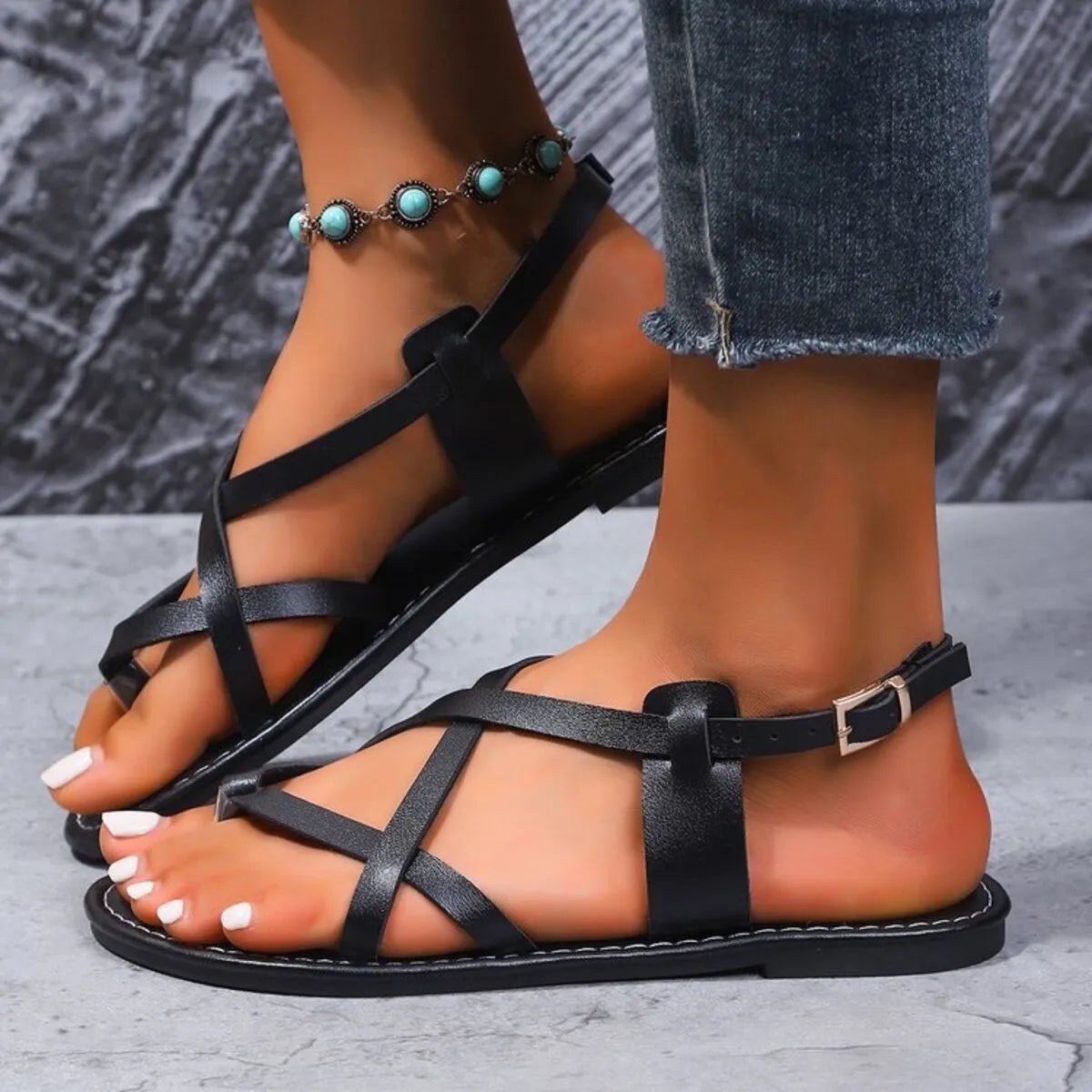 Women's comfortable faux leather flat sandals with cross and strappy design, perfect for casual summer wear.