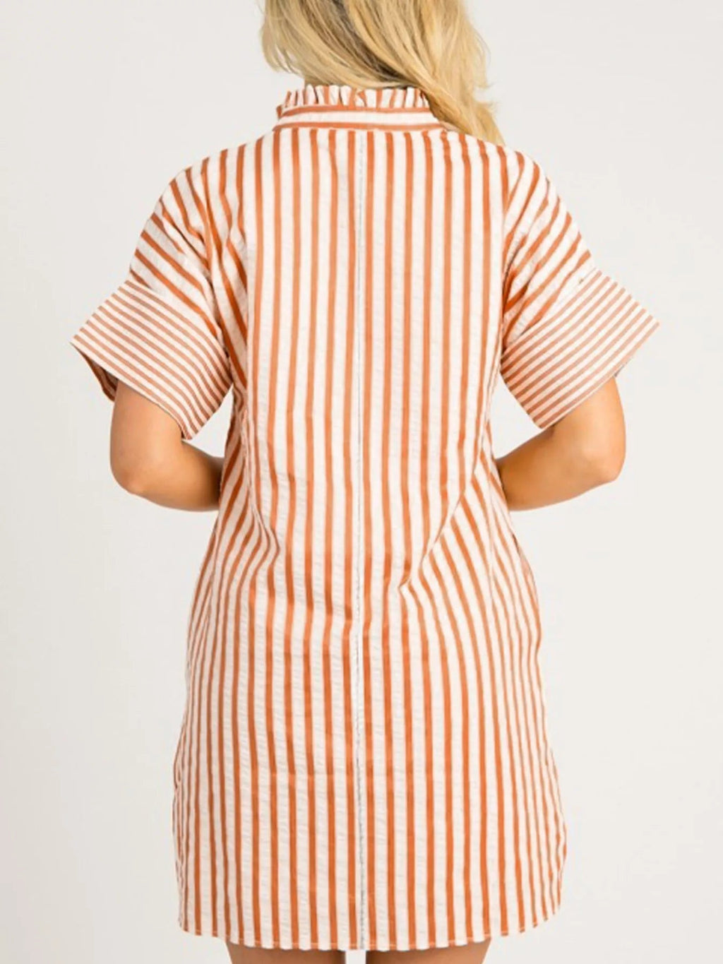 Stripe pinched V-neck mini dress by Trendsi featuring turn-up cuffs and pockets, shown on a model.