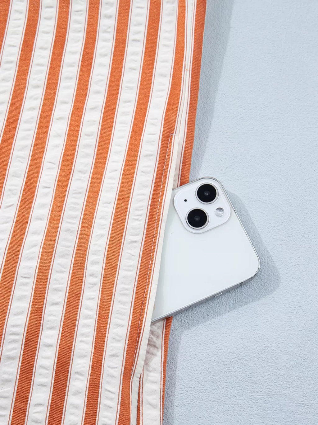 Stripe pinched V-neck mini dress by Trendsi featuring turn-up cuffs and practical pockets, perfect for casual or chic looks.