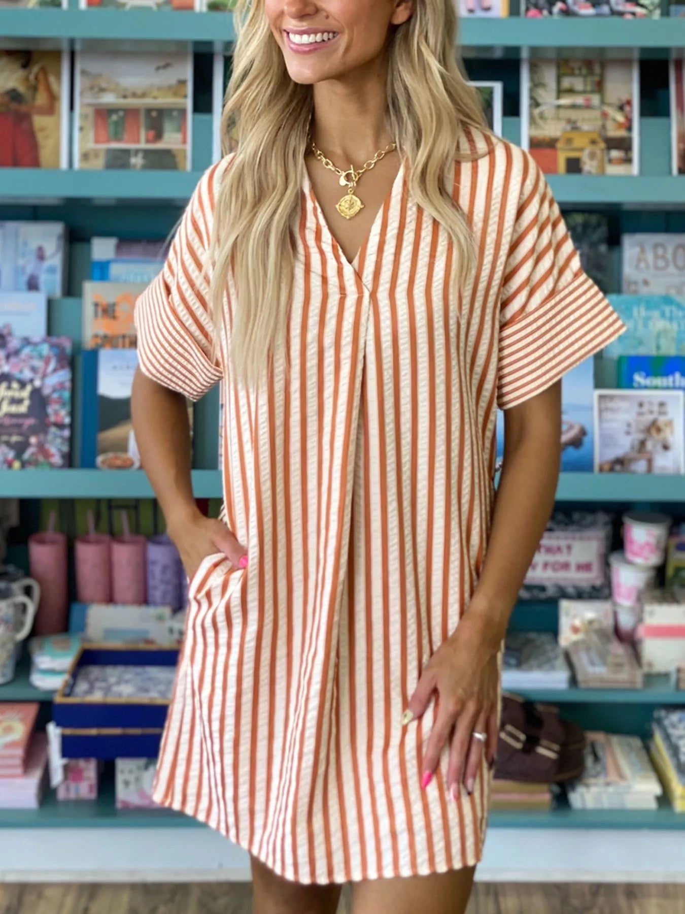 Stripe pinched V-neck mini dress with turn-up cuffs and pockets, stylish and fitted from Trendsi.