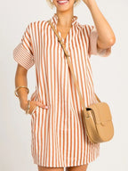 Stripe pinched V-neck mini dress with turn-up cuffs and pockets, stylish dress by Trendsi, shown on a model.