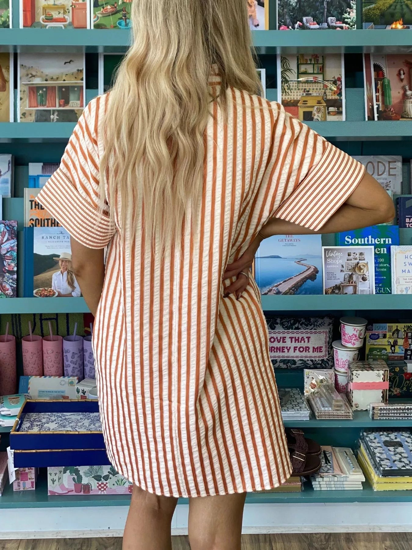 Stripe pinched V-neck mini dress by Trendsi featuring turn-up cuffs and side pockets, perfect for casual or stylish occasions.