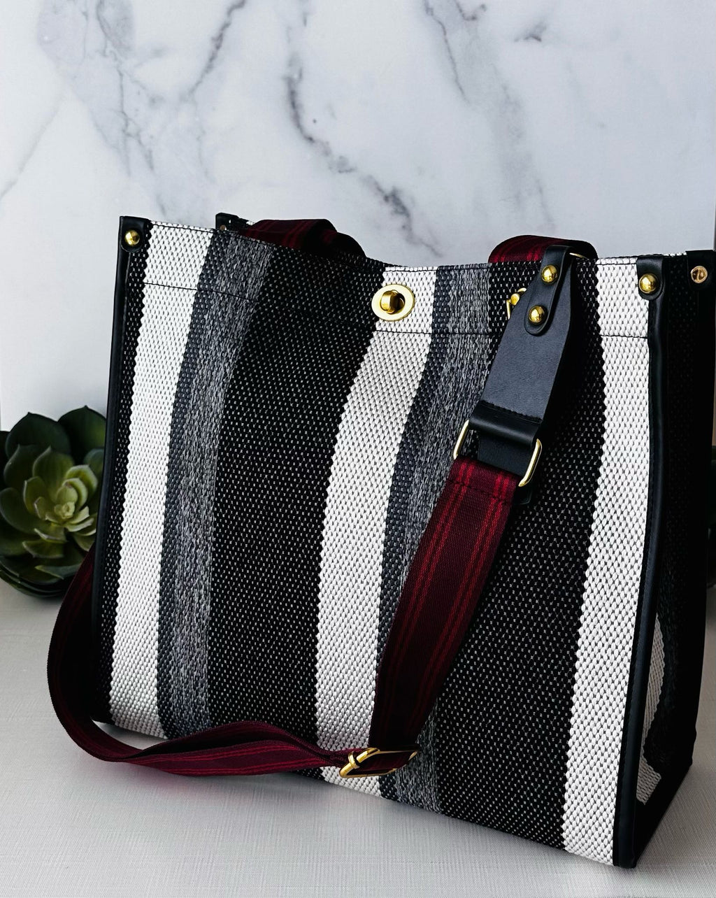 LadyShow.Store stripe tote bag featuring a classic striped design, durable fabric, and spacious interior for everyday use.