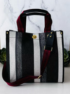 LadyShow.Store stripe tote bag with white and black horizontal stripes, showing the front view with handles and spacious interior.