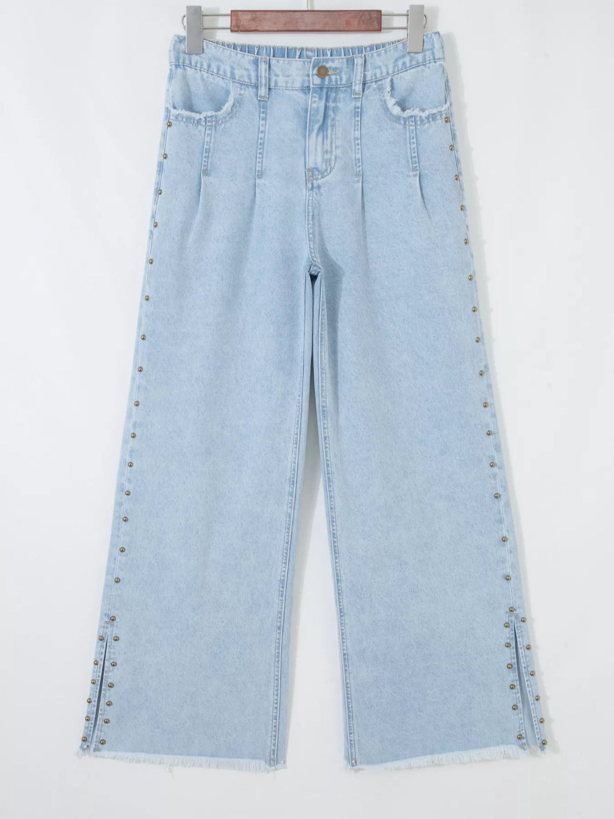 Plush Fashion Hub studded wide-leg jeans with frayed hem and side slits, showcasing a trendy denim style and distressed details.