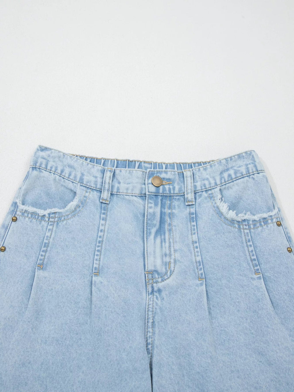 Trendsi studded wide leg jeans with frayed hem and side slits, showcasing distressed denim and fashionable design details.