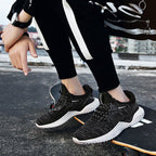 Pair of FitiqueFit breathable running shoes for students, showcasing lightweight design and comfortable athletic footwear.