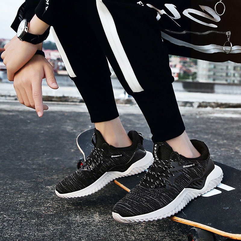 Pair of FitiqueFit breathable running shoes for students, showcasing lightweight design and comfortable athletic footwear.